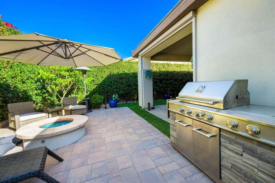 51287 Longmeadow Street Indio, CA 92201 - Photo 2 of 22 a backyard of a house with yard barbeque oven and outdoor seating
