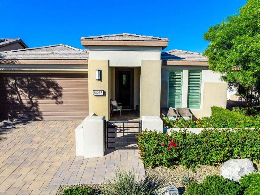 51287 Longmeadow Street Indio, CA 92201 - Photo 21 of 22 a front view of a house with garden