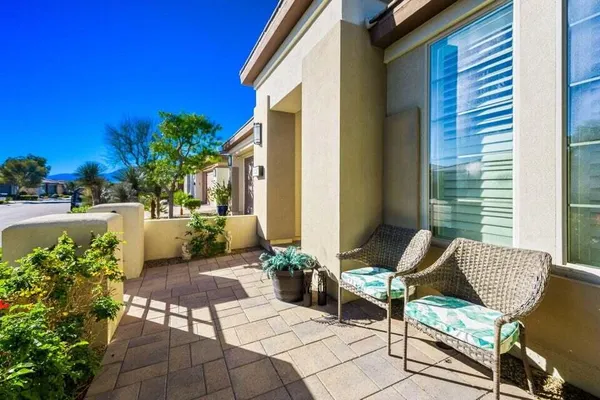 a view of a patio with chair and tables