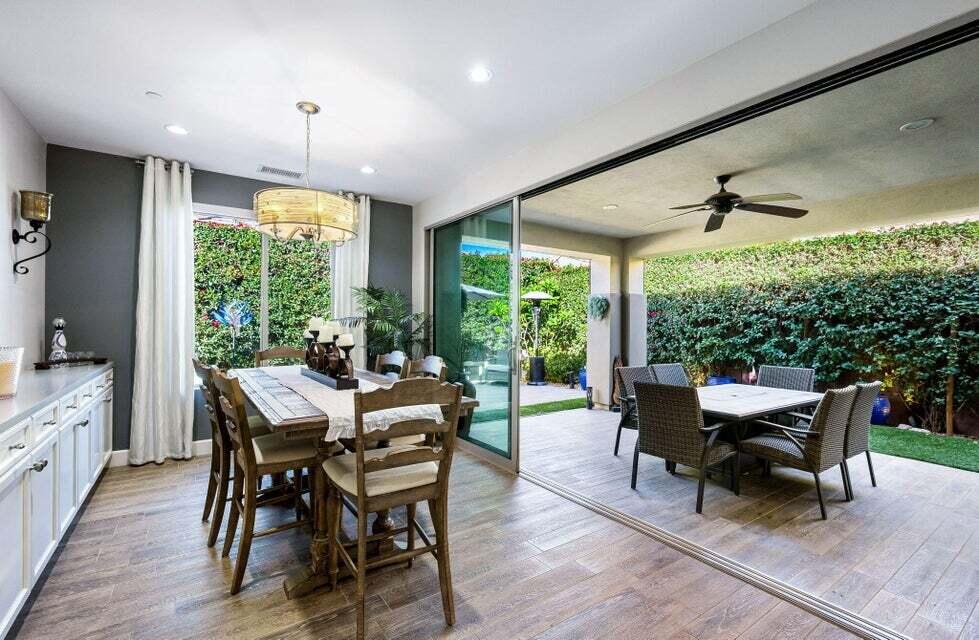 51287 Longmeadow Street Indio, CA 92201 - Photo 5 of 22 a view of a dining room with furniture window and wooden floor