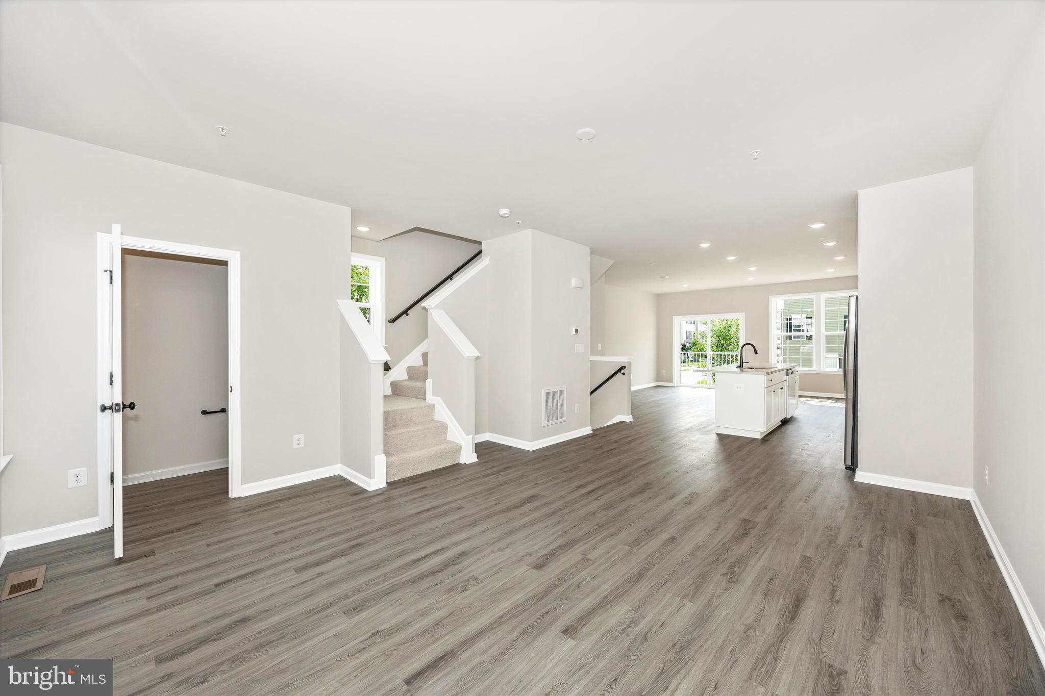 106 Spring Bank Way Frederick, MD 21701 - Photo 3 of 14 a view of empty room with wooden floor