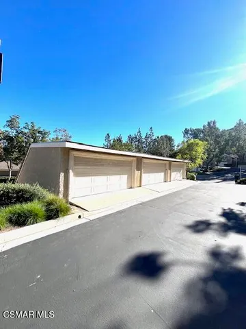 a kitchen with stainless steel appliances granite countertop a sink and counter top space