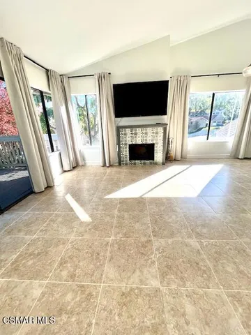 a view of living room with furniture and a flat screen tv