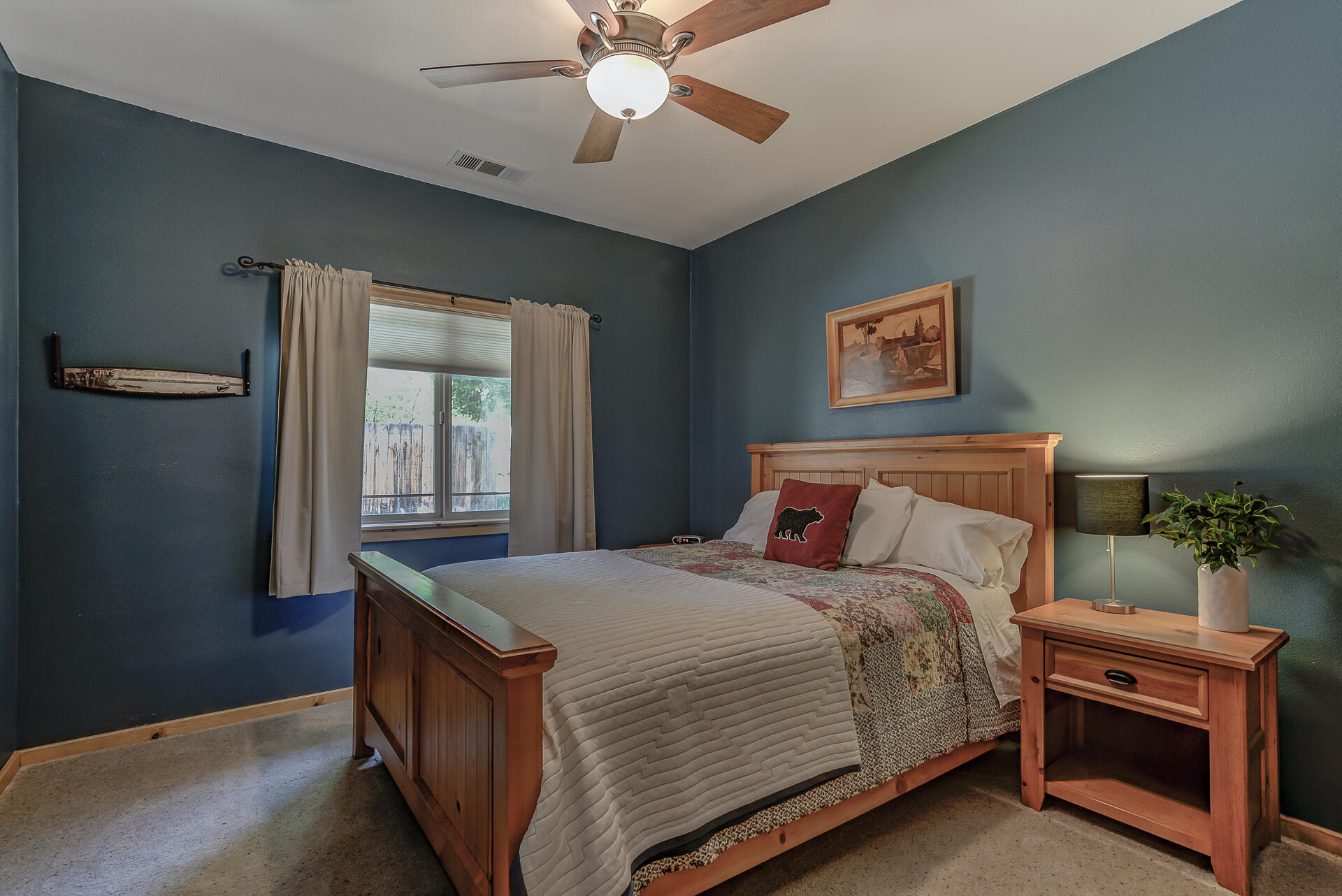 2490 Goose Ranch Road Lewiston, CA 96052 - Photo 16 of 38 a bedroom with a bed and a chandelier