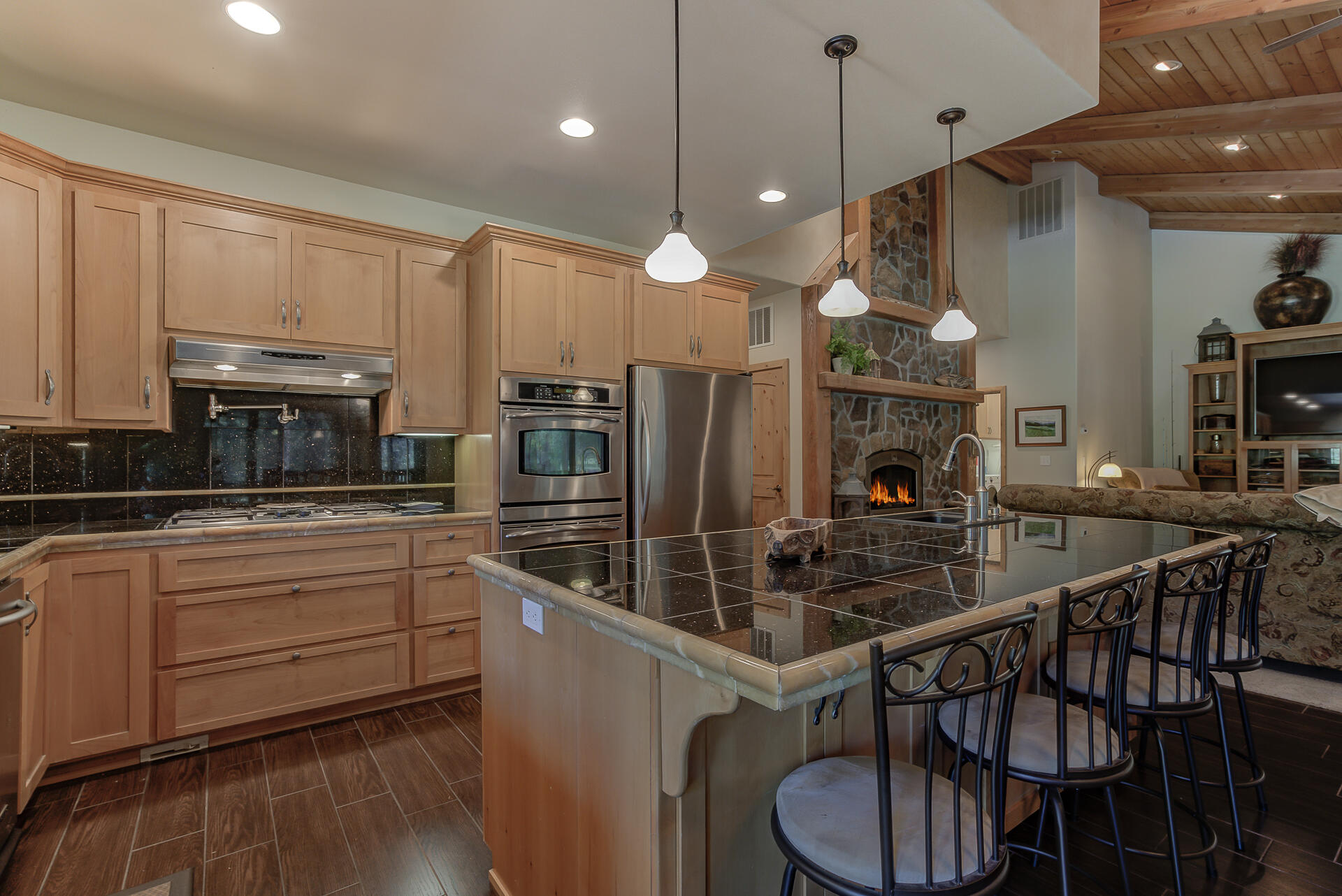 2490 Goose Ranch Road Lewiston, CA 96052 - Photo 10 of 38 a kitchen with stainless steel appliances kitchen island granite countertop a stove a sink and a refrigerator