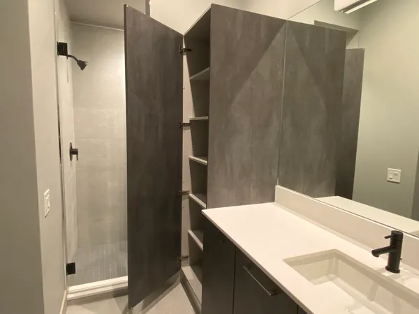 a bathroom with a sink and vanity