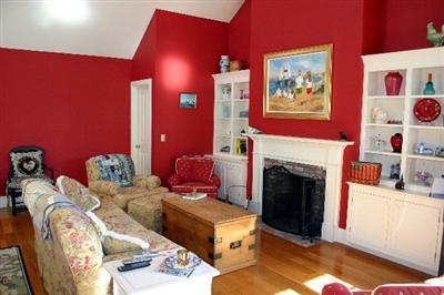 31 Hallet Lane Chatham, MA 02633 - Photo 12 of 22 a bed room with furniture and a fireplace