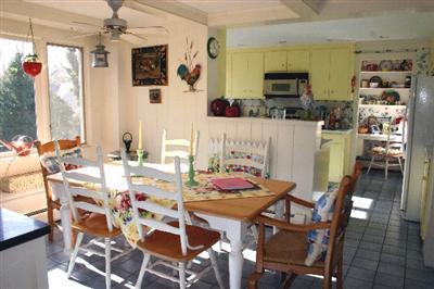 31 Hallet Lane Chatham, MA 02633 - Photo 13 of 22 a view of a dining room with furniture and wooden floor