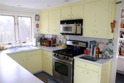 31 Hallet Lane Chatham, MA 02633 - Photo 14 of 22 a kitchen with a sink stove and microwave