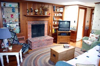 31 Hallet Lane Chatham, MA 02633 - Photo 15 of 22 a living room with furniture and a fireplace