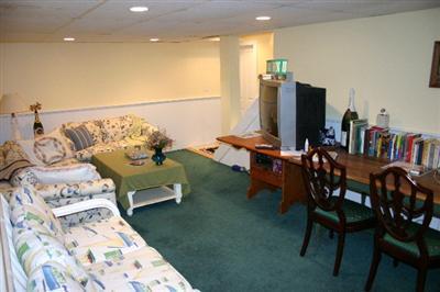 31 Hallet Lane Chatham, MA 02633 - Photo 20 of 22 a living room with furniture and a flat screen tv