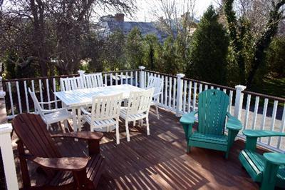 31 Hallet Lane Chatham, MA 02633 - Photo 7 of 22 a view of a chairs and table on the deck