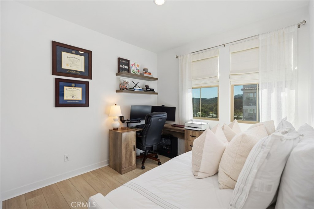 1401 Lasso Way, Unit 301 Rancho Mission Viejo, CA 92694 - Photo 15 of 43 Bright and airy, secondary bedroom, including a custom closet organizer.