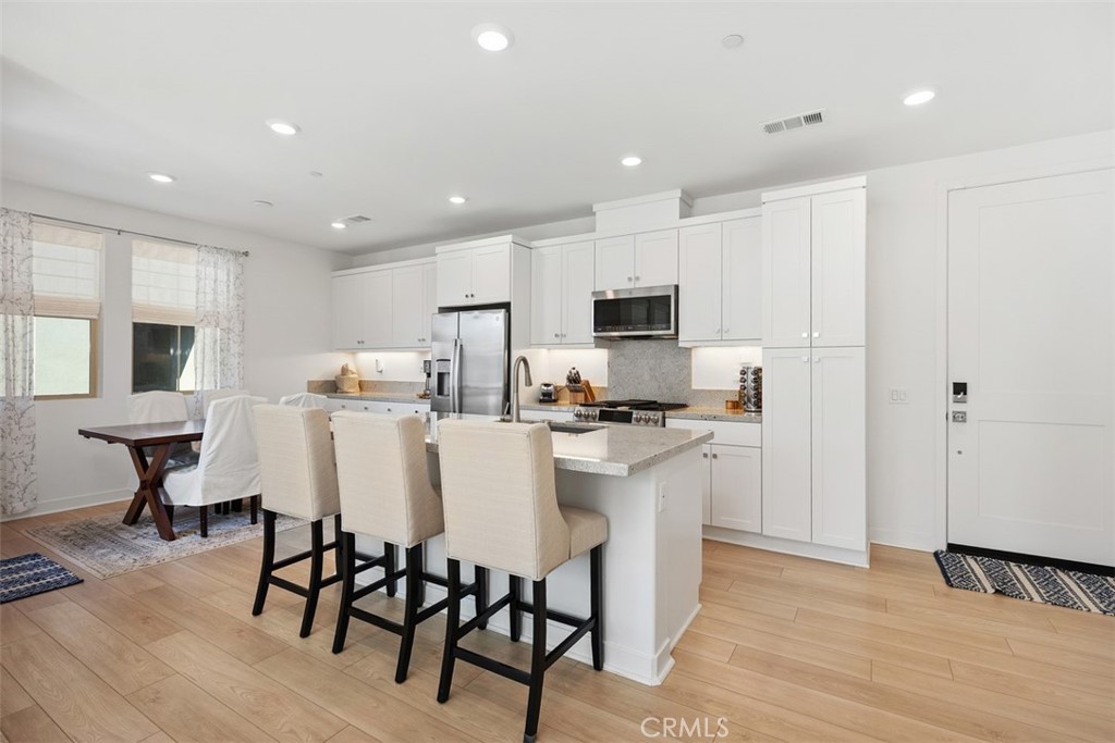 1401 Lasso Way, Unit 301 Rancho Mission Viejo, CA 92694 - Photo 7 of 43 Large inviting kitchen island with an eating area.