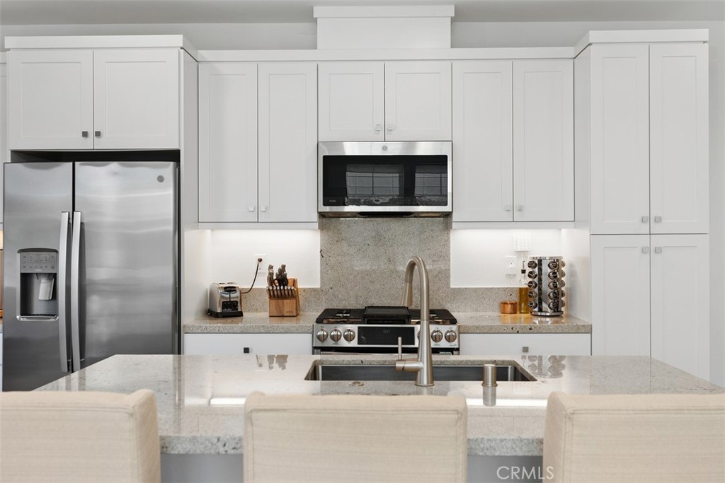 1401 Lasso Way, Unit 301 Rancho Mission Viejo, CA 92694 - Photo 8 of 43 Stainless appliances with plenty of counter space.