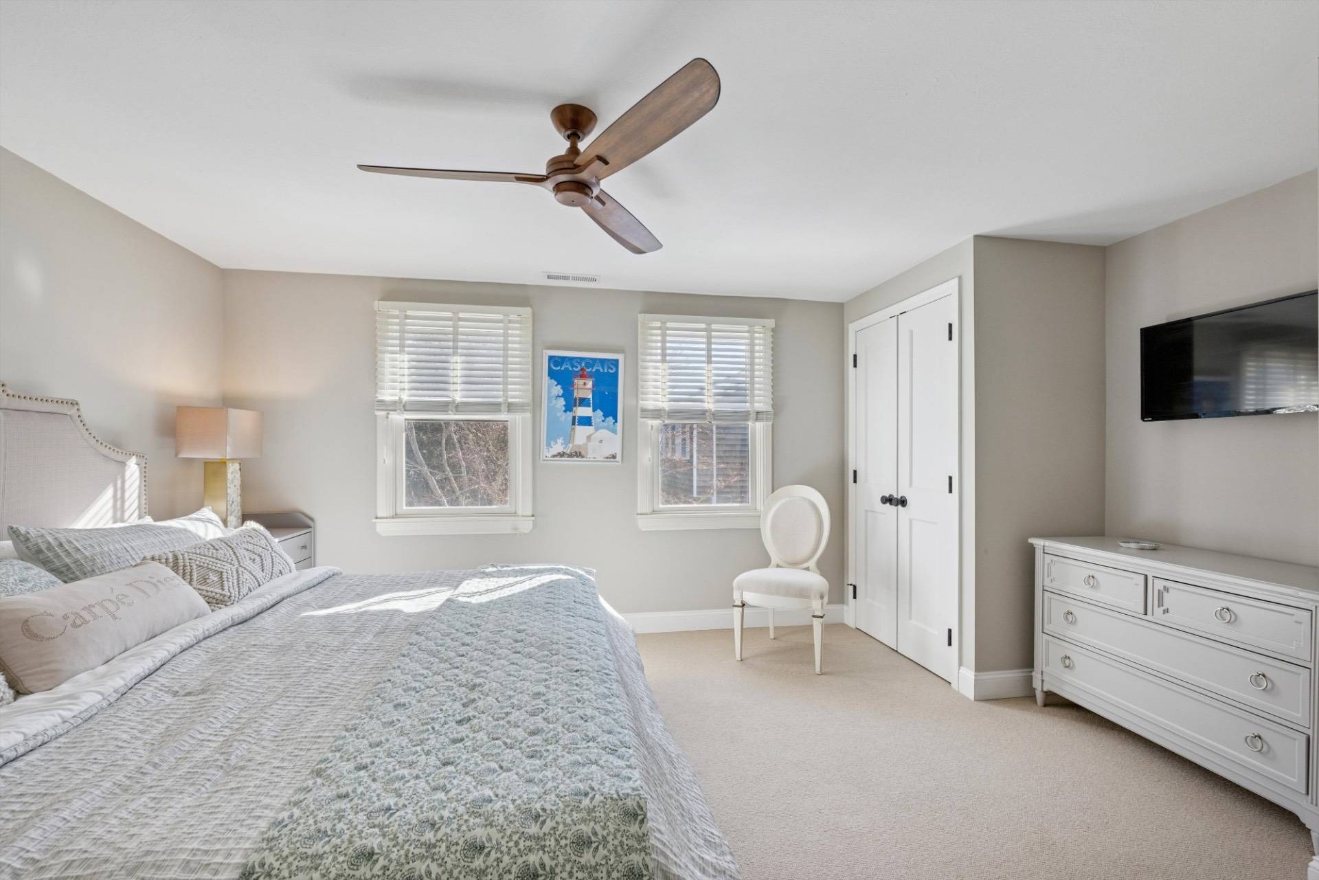 570 Hampton Road, Unit 22 Southampton, NY 11968 - Photo 15 of 26 a bedroom with a bed and a television