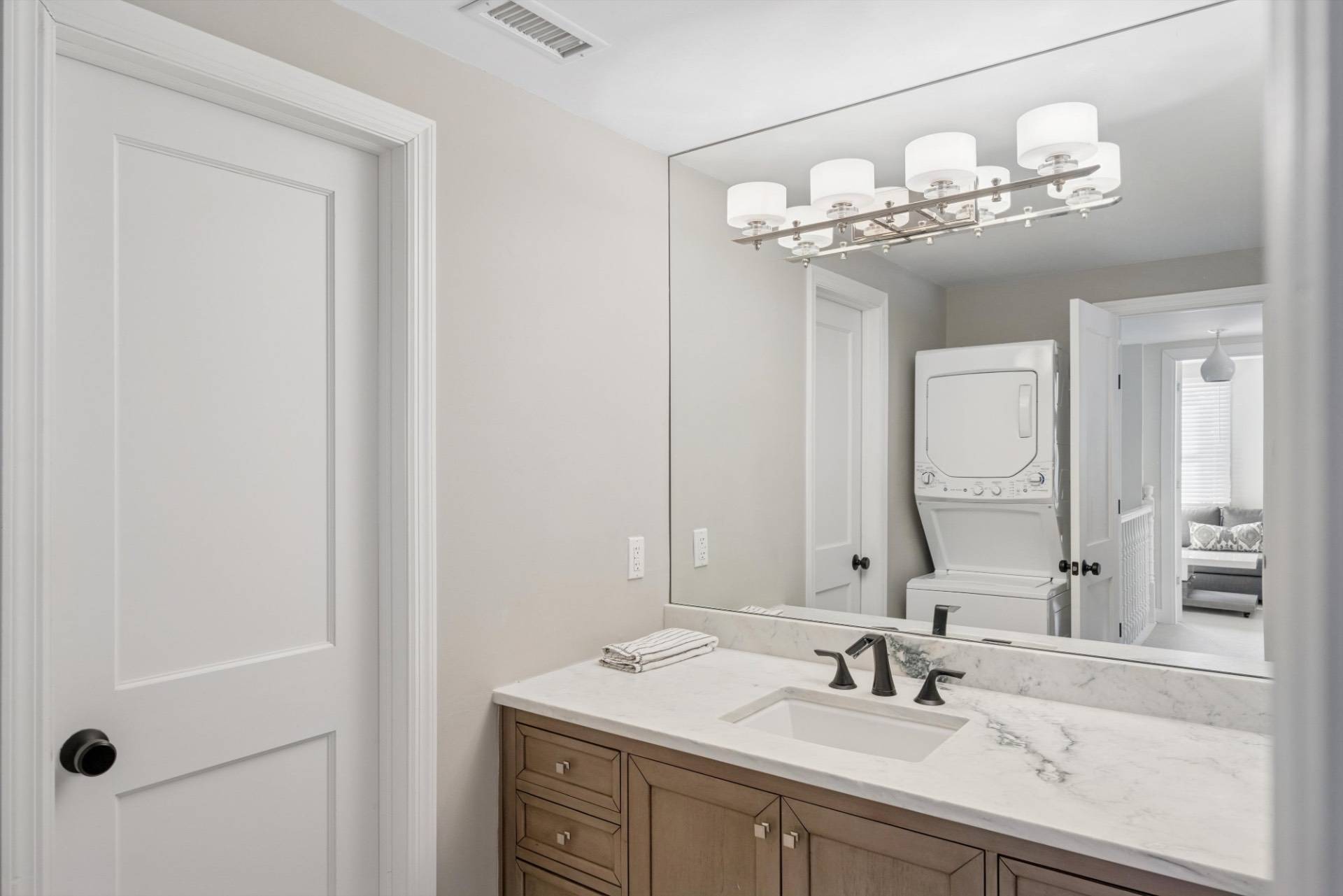 570 Hampton Road, Unit 22 Southampton, NY 11968 - Photo 16 of 26 a bathroom with a sink and a mirror