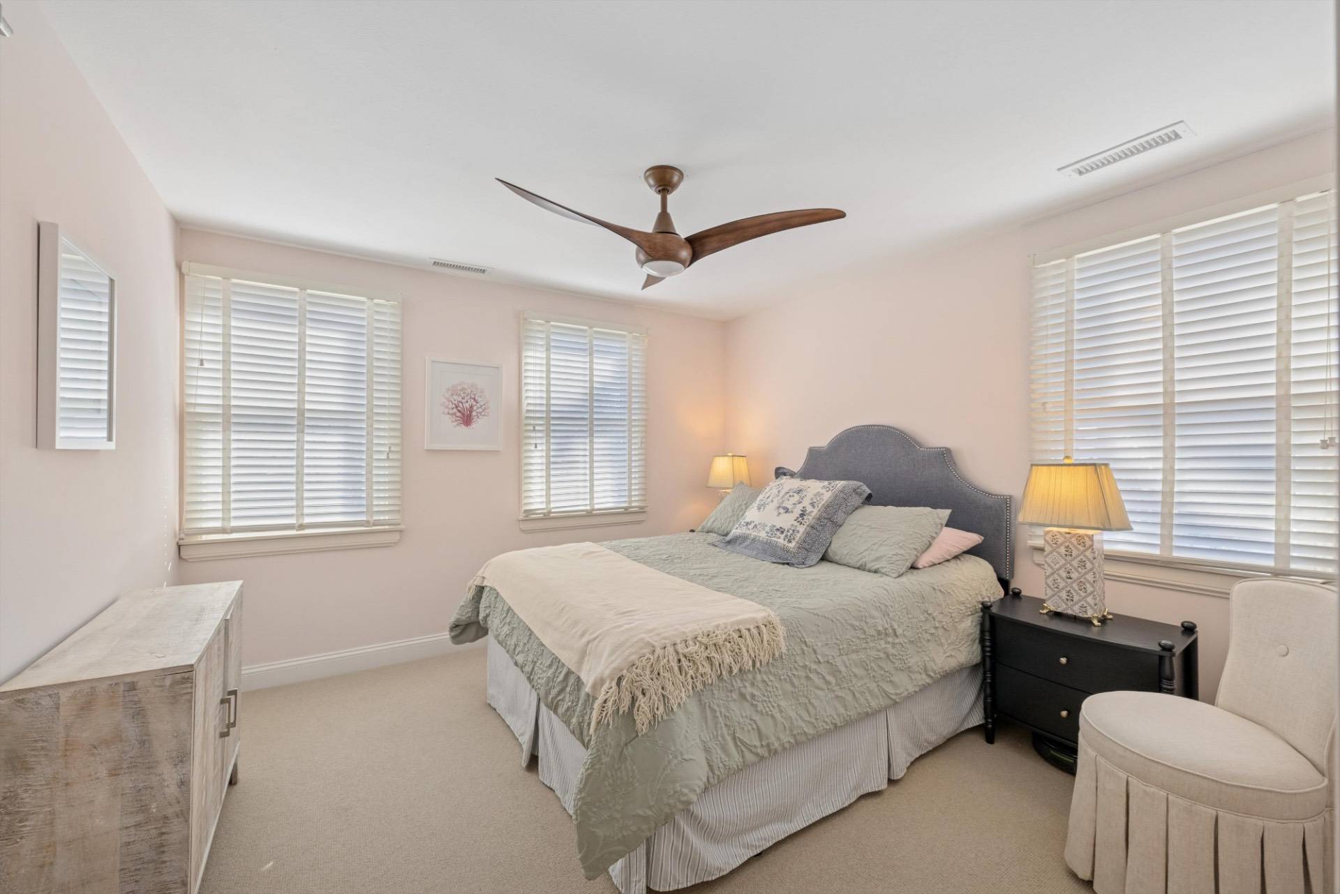 570 Hampton Road, Unit 22 Southampton, NY 11968 - Photo 18 of 26 a bedroom with a bed couch and window