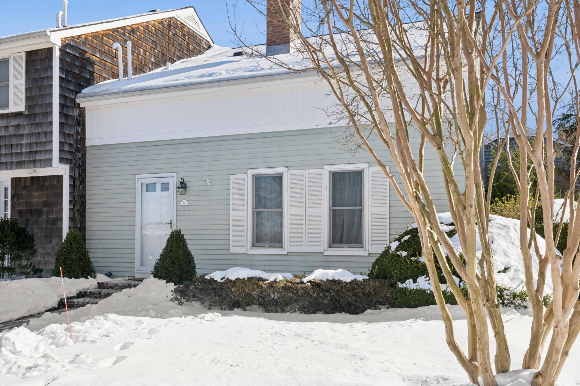 570 Hampton Road, Unit 22 Southampton, NY 11968 - Photo 2 of 26 a view of a house with a yard