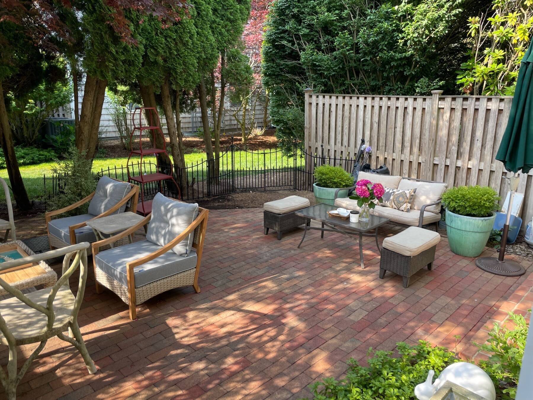 570 Hampton Road, Unit 22 Southampton, NY 11968 - Photo 23 of 26 a view of a backyard with sitting area and furniture
