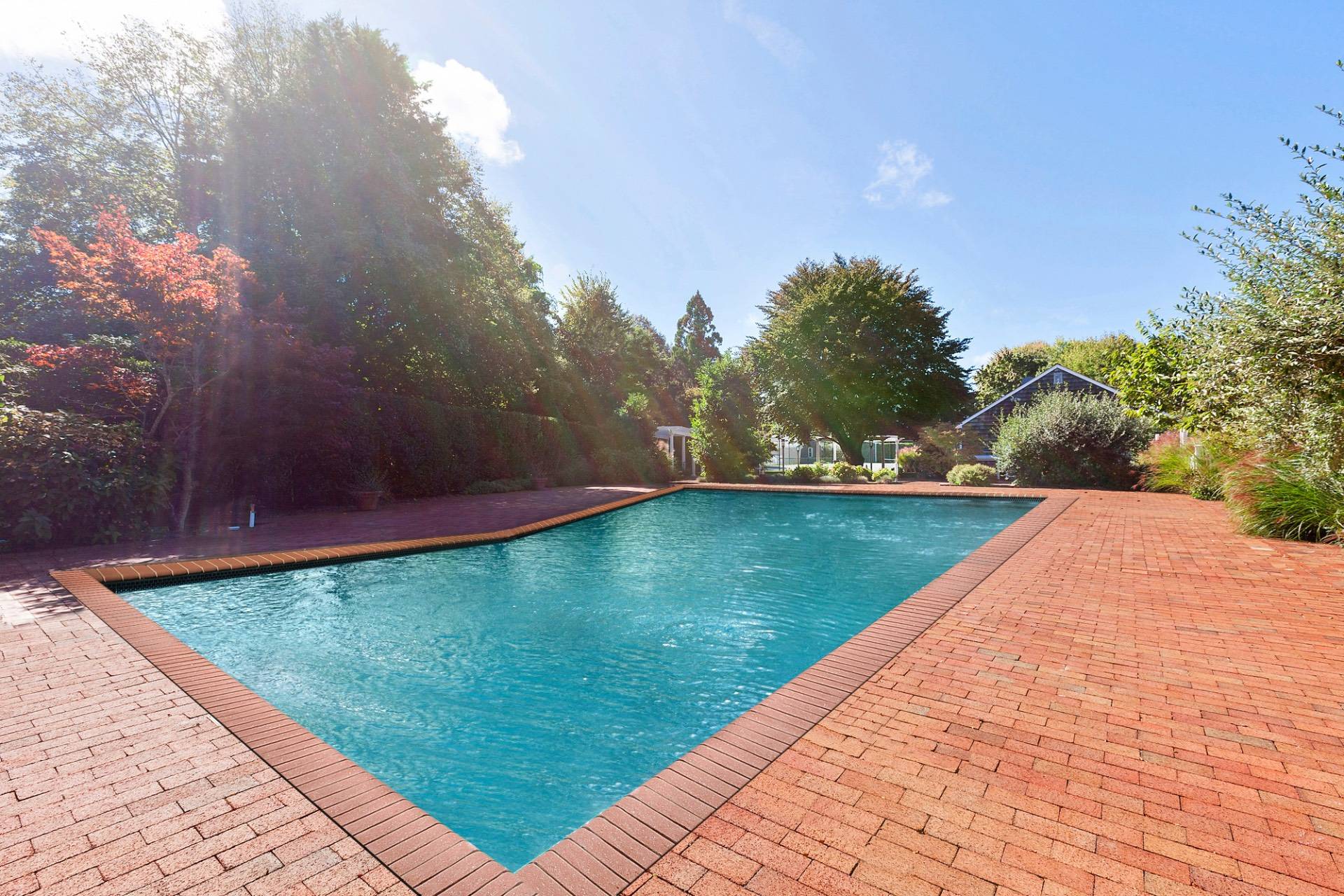 570 Hampton Road, Unit 22 Southampton, NY 11968 - Photo 4 of 26 a view of swimming pool with a yard