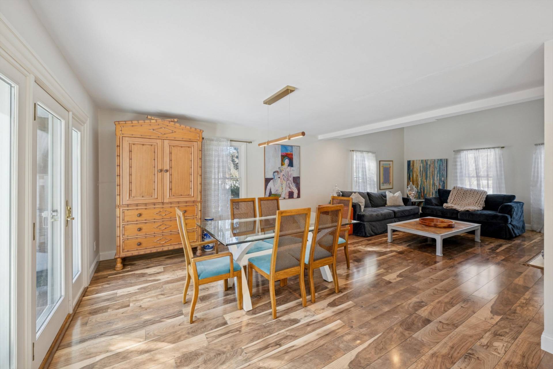 570 Hampton Road, Unit 22 Southampton, NY 11968 - Photo 7 of 26 a living room with furniture wooden floor and a window