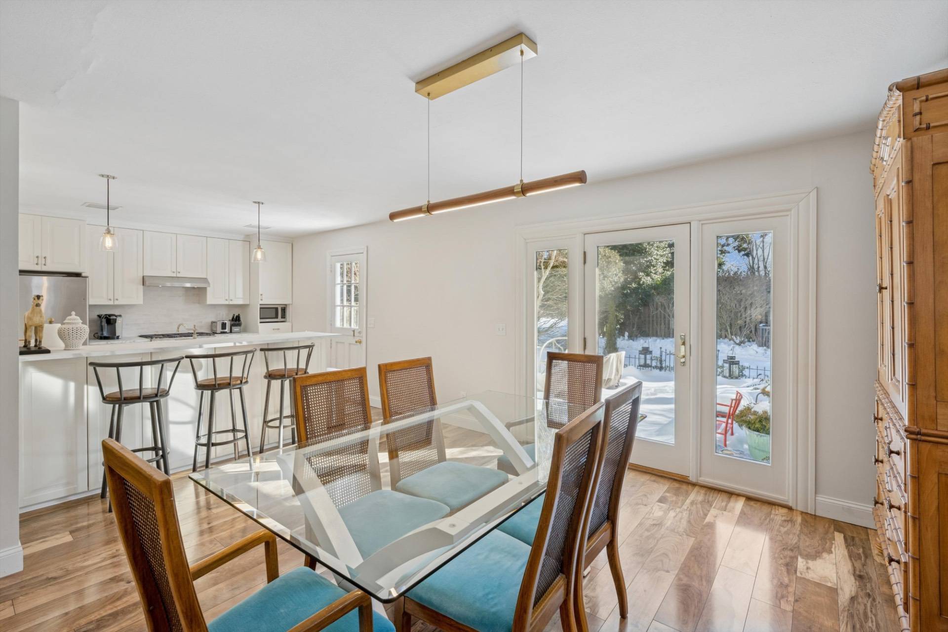 570 Hampton Road, Unit 22 Southampton, NY 11968 - Photo 8 of 26 a view of a dining room with furniture window and wooden floor
