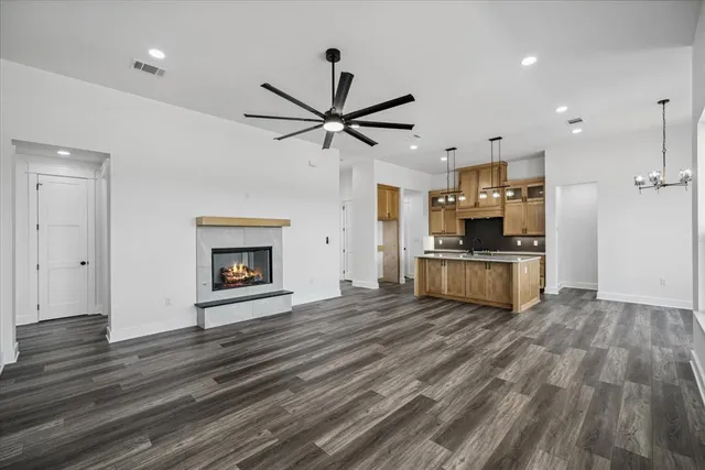 a view of kitchen with sink and wooden floor