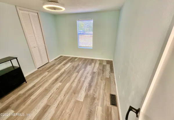 a view of a backyard with a patio