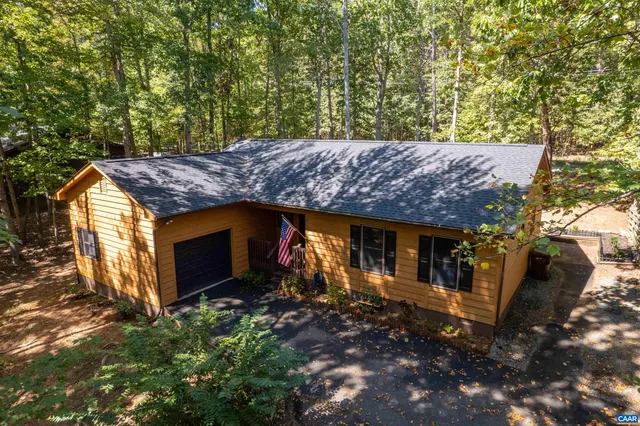 a view of a couches under an umbrella