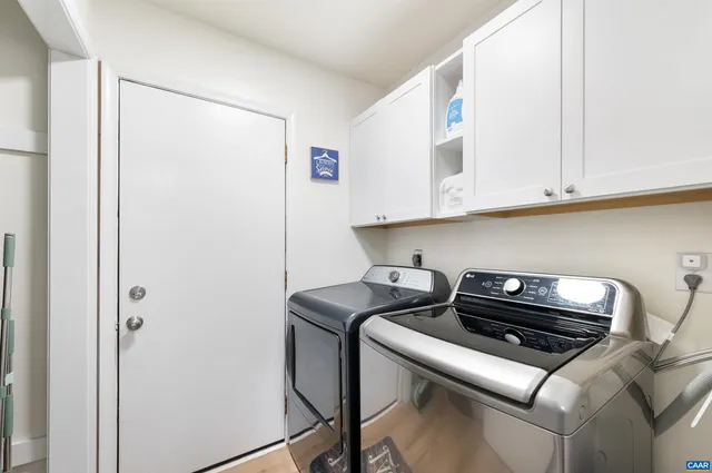 a bedroom with furniture and a wooden floor