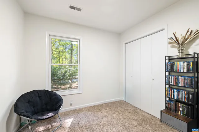 a view of a wooden floor and bench on the side of the road