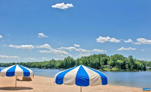 an aerial view of a house with a yard basket ball court and outdoor seating