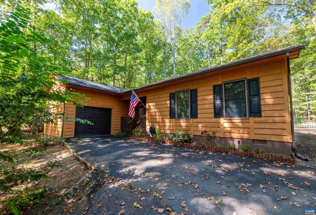 a front view of a house with yard