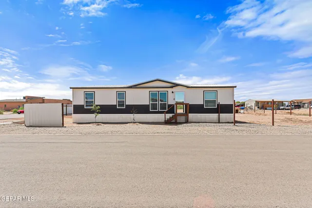 a outdoor space with lots of furniture and a projector