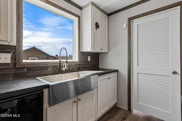 a kitchen with stainless steel appliances granite countertop a stove and a sink