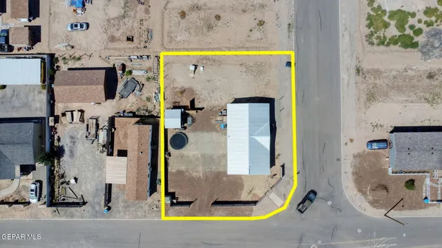 an aerial view of a wooden chairs and a table