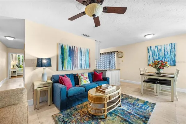 a living room with furniture and a rug