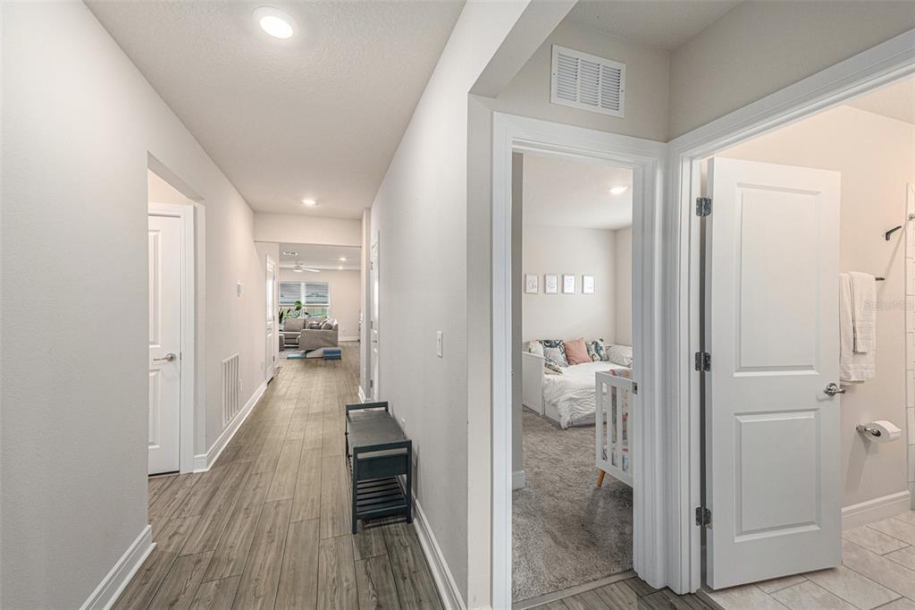 8312 Reefbay Cove Parrish, FL 34221 - Photo 21 of 36 a view of a hallway with wooden floor and closet