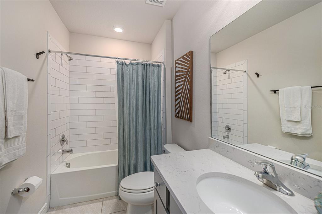 8312 Reefbay Cove Parrish, FL 34221 - Photo 22 of 36 a bathroom with a sink toilet and shower