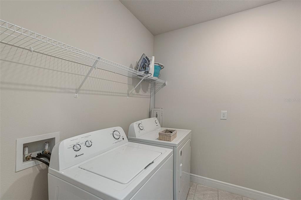 8312 Reefbay Cove Parrish, FL 34221 - Photo 23 of 36 a utility room with dryer and washer