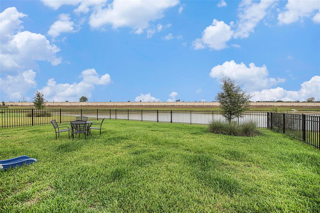 8312 Reefbay Cove Parrish, FL 34221 - Photo 25 of 36 a view of a house with a big yard and a large tree