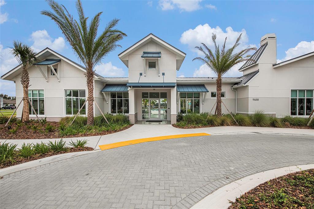 8312 Reefbay Cove Parrish, FL 34221 - Photo 31 of 36 a front view of a house with a yard and potted plants