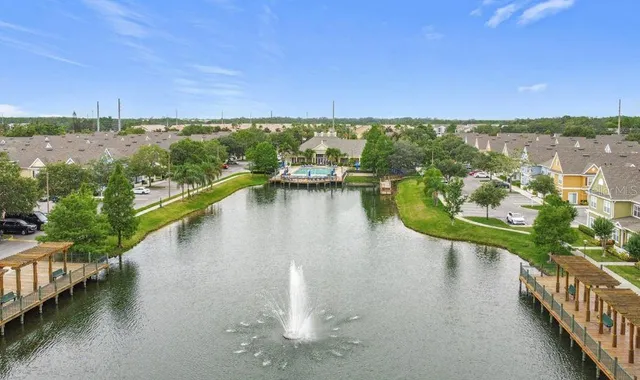 a view of a swimming pool and lounge chair