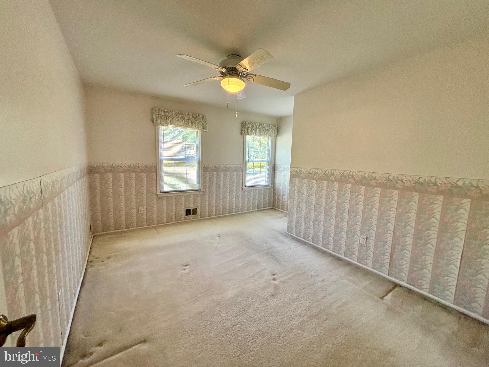 20 Bock Boulevard Howell, NJ 07731 - Photo 31 of 32 a view of an empty room with wooden floor and a window