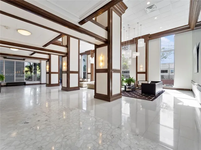 a view of an entryway with wooden floor and windows