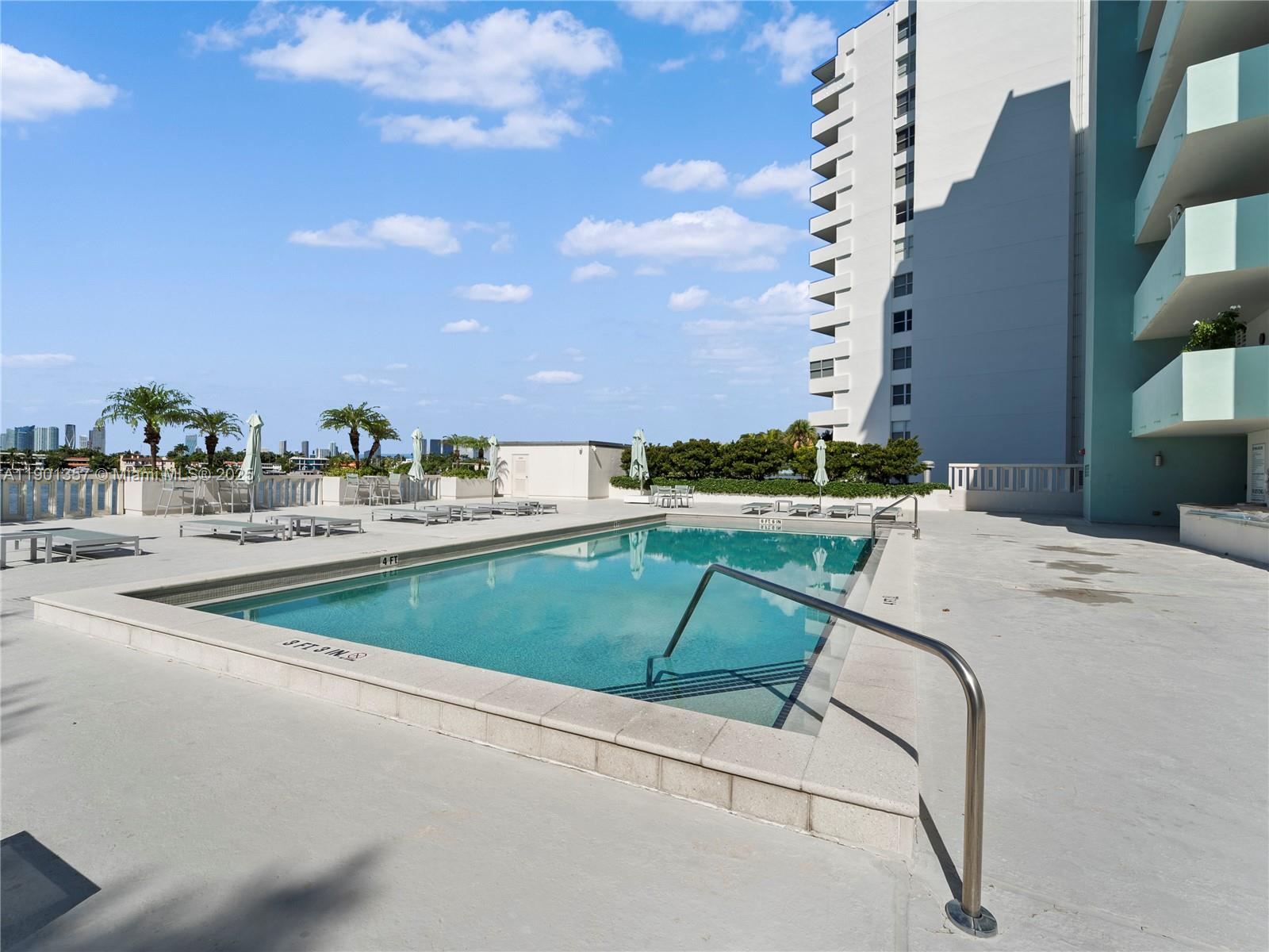 5 Island Avenue, Unit LE Miami Beach, FL 33139 - Photo 25 of 30 a view of a swimming pool with a yard