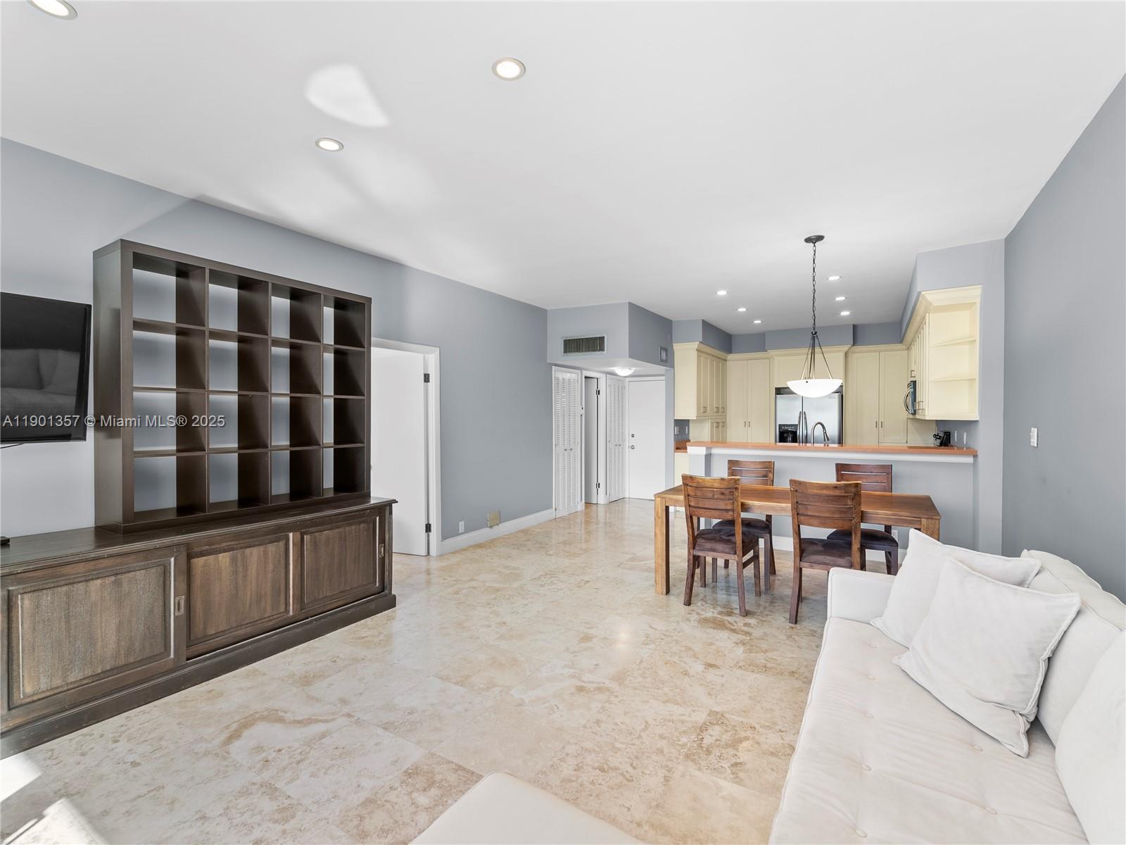 5 Island Avenue, Unit LE Miami Beach, FL 33139 - Photo 3 of 30 a living room with furniture a dining table and kitchen view