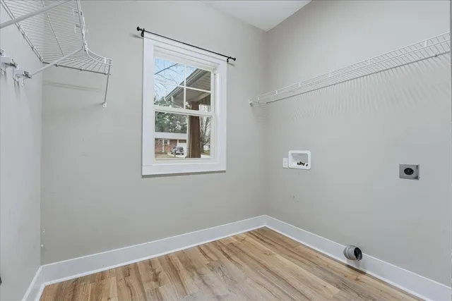 a view of room with window and hardwood floor