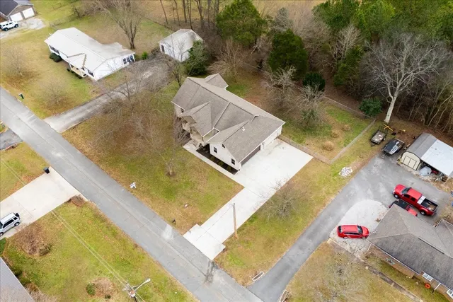 an aerial view of a house with swimming pool